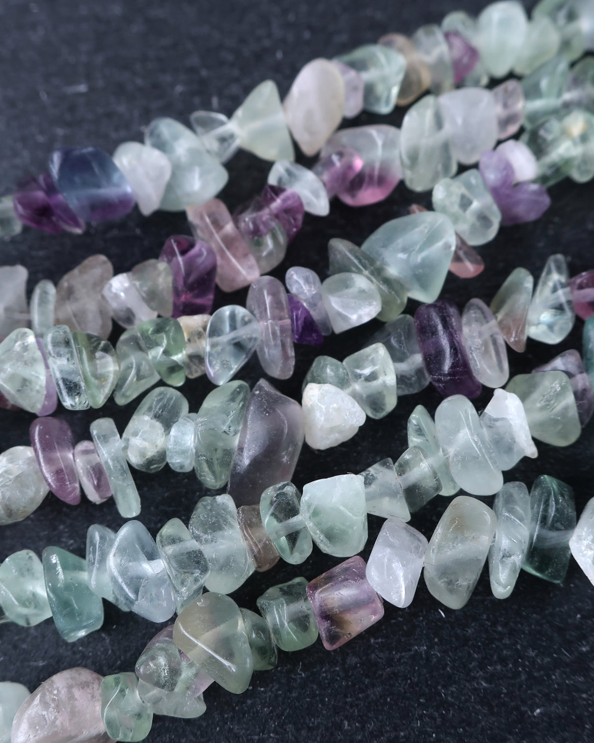 Medium Rainbow Fluorite Chip Beads · 30" strand