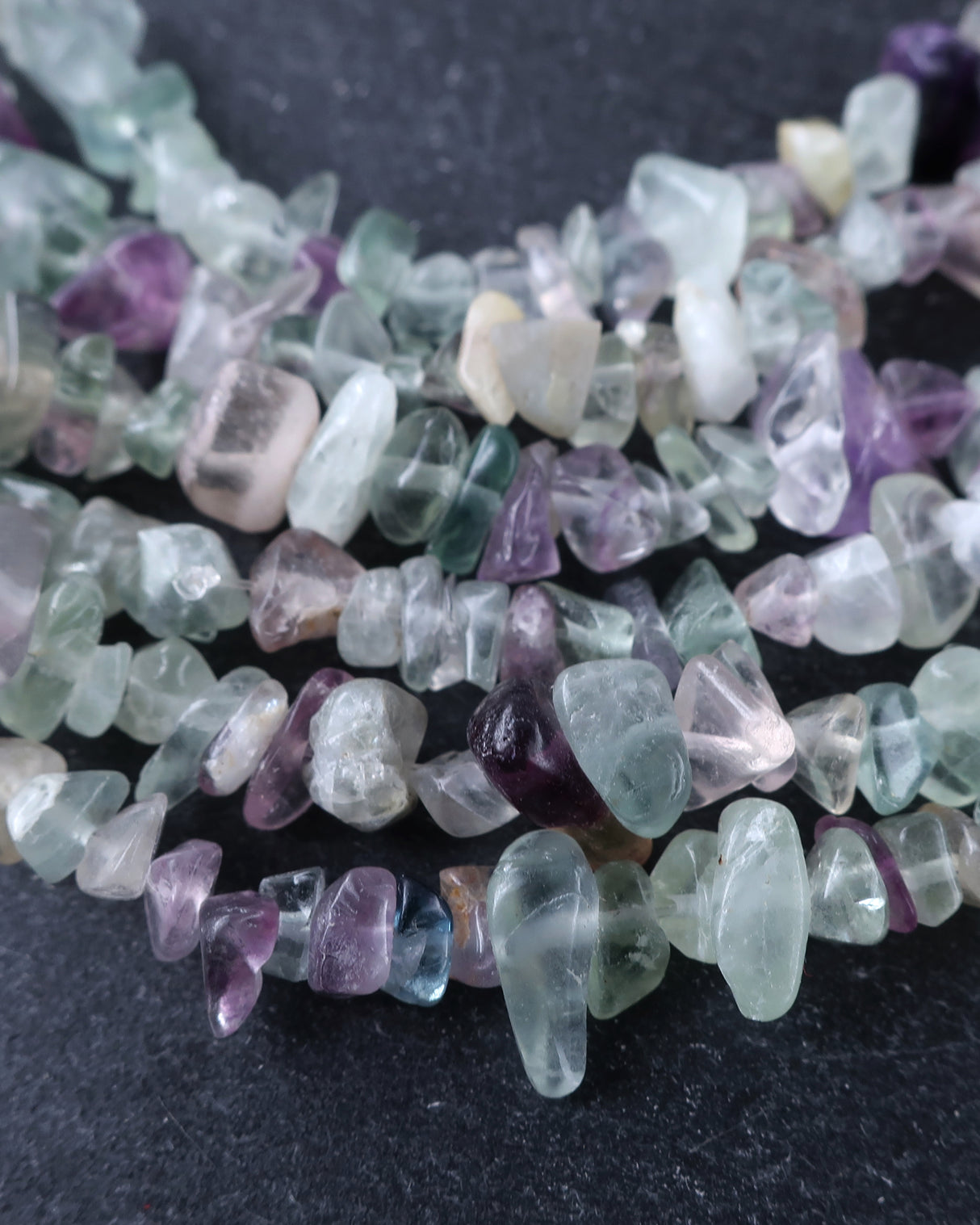 Medium Rainbow Fluorite Chip Beads · 30" strand