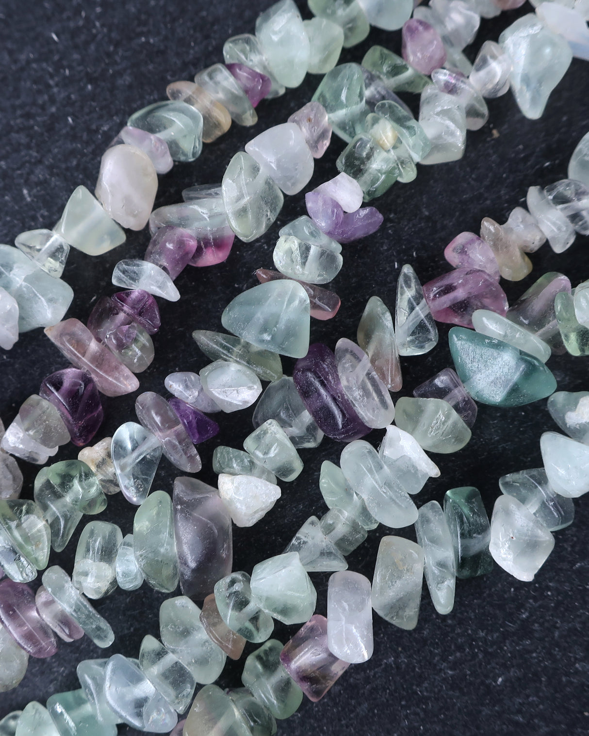 Medium Rainbow Fluorite Chip Beads · 30" strand