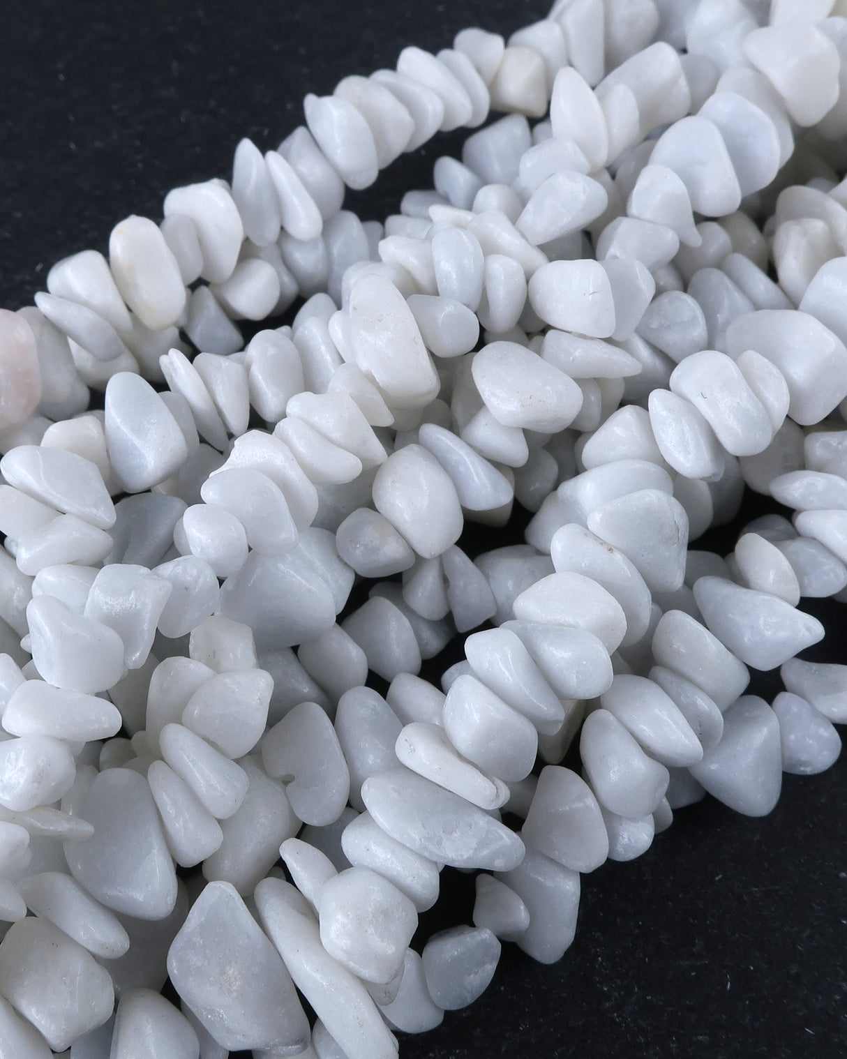 Medium White Feldspar Chip Beads · 30" strand