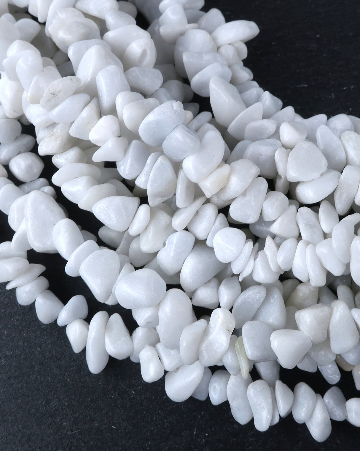 Medium White Feldspar Chip Beads · 30" strand