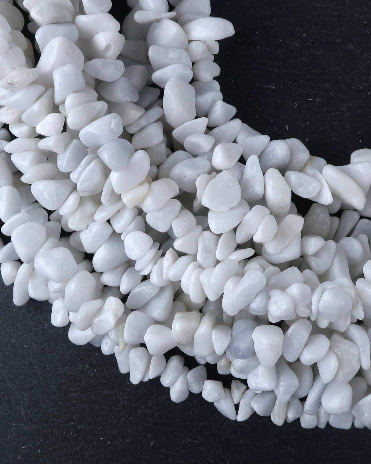 Medium White Feldspar Chip Beads · 30" strand