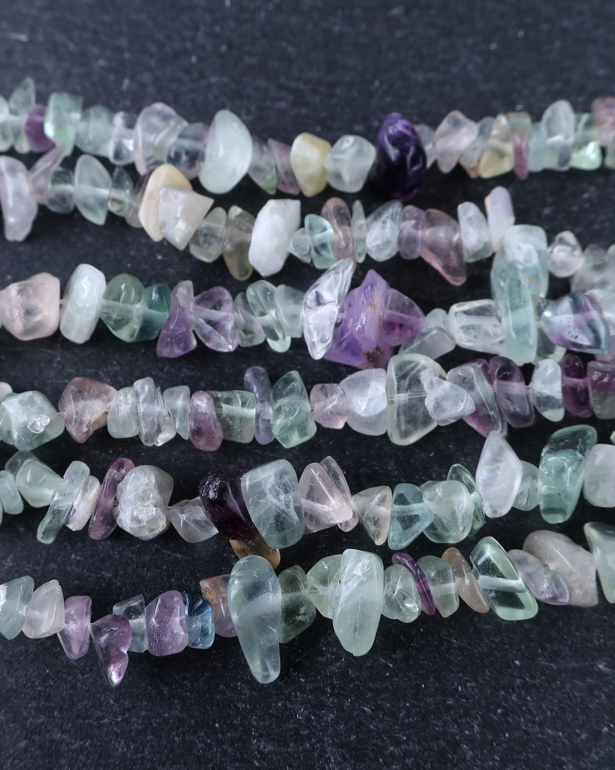 Medium Rainbow Fluorite Chip Beads · 30" strand