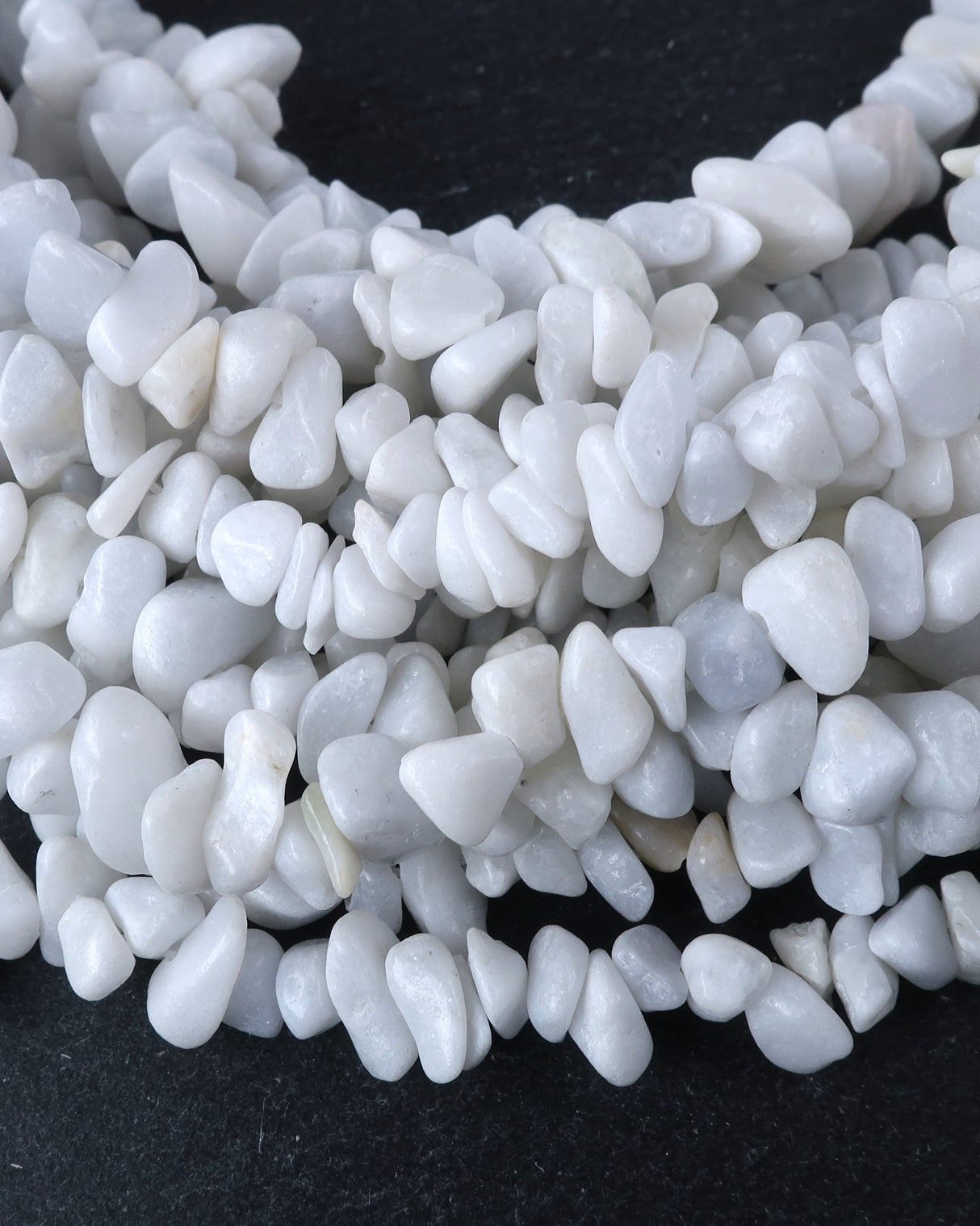 Medium White Feldspar Chip Beads · 30" strand