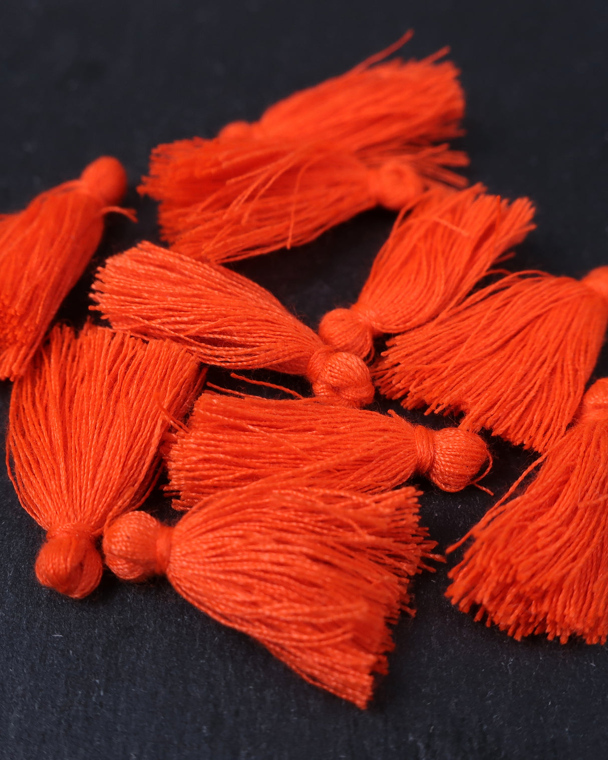 Mini Neon Orange Tassels · 10 pack